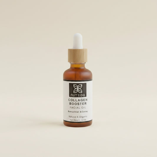 Bottle of Nutrida Collagen Booster Facial Oil on a beige fabric background