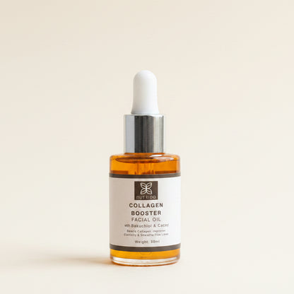 A 30ml dropper bottle of Nutripa Collagen Booster Facial Oil, filled with amber-colored oil, resting on a black surface in front of a window with beige curtains.