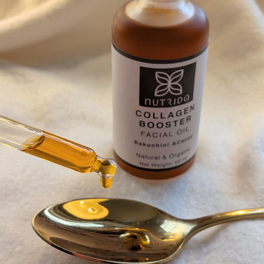Nutrida Collagen Booster Facial Oil bottle with dropper and oil on a spoon
