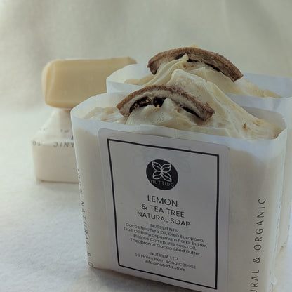 Bar of lemon and tea tree natural soap with a visible label on a light background